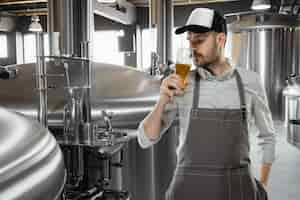 Free photo professional brewer on his own craft alcohol production