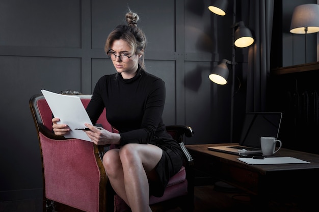 Professional businesswoman looking into papers