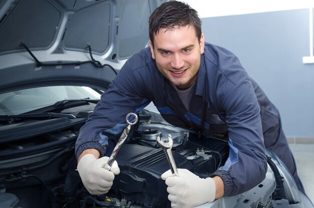 Professional car mechanic in repair shop