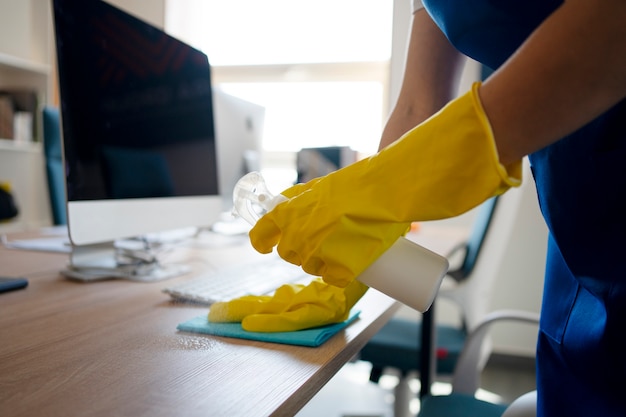 Free photo professional cleaning service person cleaning office