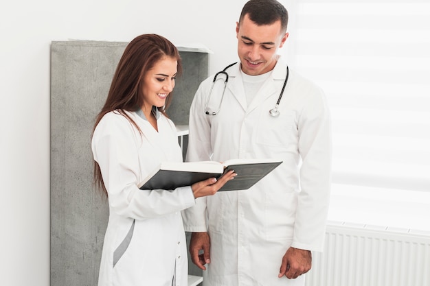 Professional doctors looking in a file