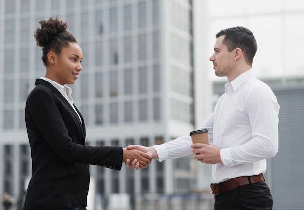 Professional employees agreeing medium shot