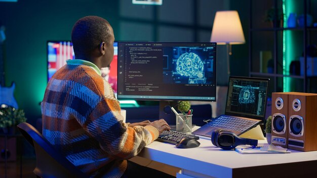 professional male developer manages neural network at desk