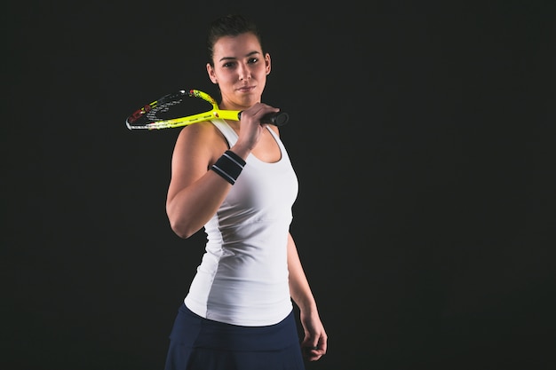 Professional player with racket on shoulder