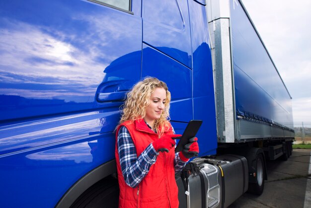 Professional truck driver setting up navigation for destination