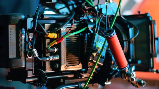 Professional video camera on the movie set with a lot of cables