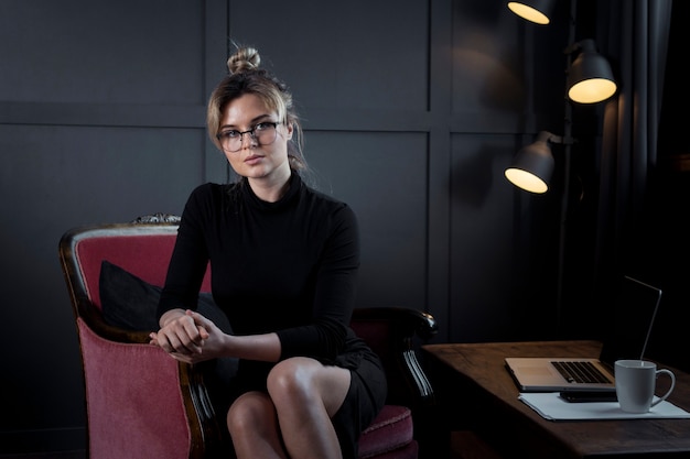 Professional young woman posing at the office