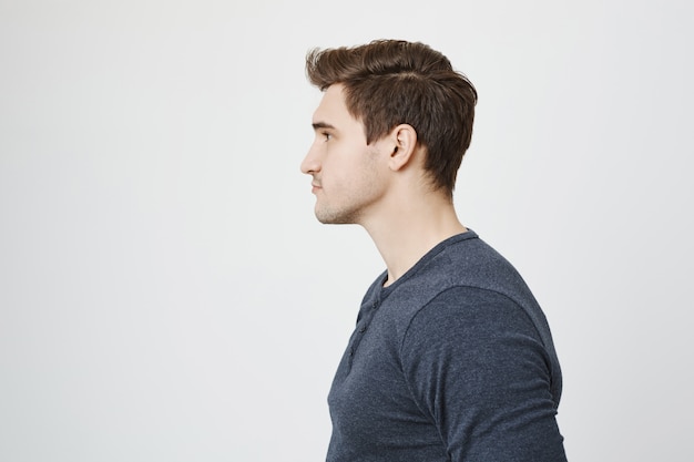 Profile of handsome stylish young man looking left