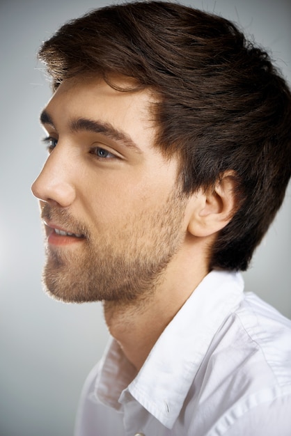 Profile shot of bearded young man look left