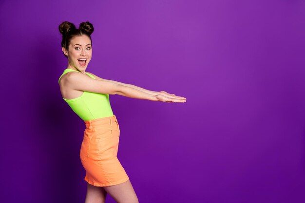 Profile side photo of positive girl hold hand copyspace wear tank-top isolated over bright color background