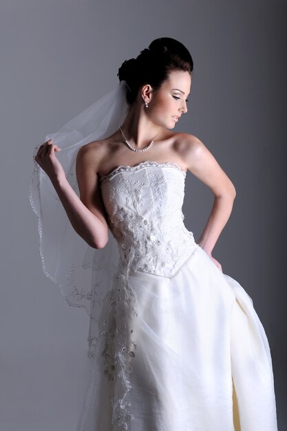 Profile view of beautiful bride dressed in  white dress