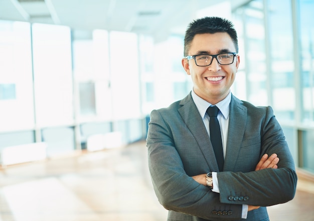 Proud businessman in his office