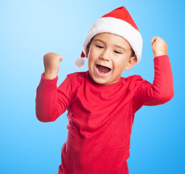 Proud little boy with fists up