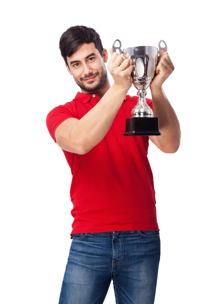 Free Photo proud teen holding up the silver cup