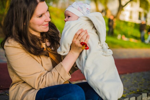 Proud woman looking at her baby