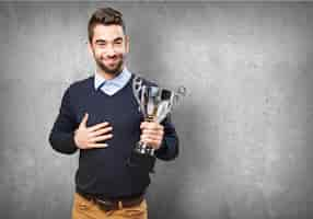 Free photo proud young man showing his award