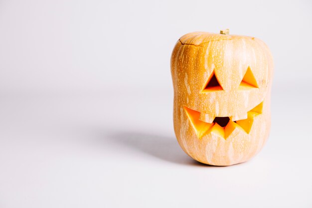 Pumpkin carved jack-o-lantern on white background