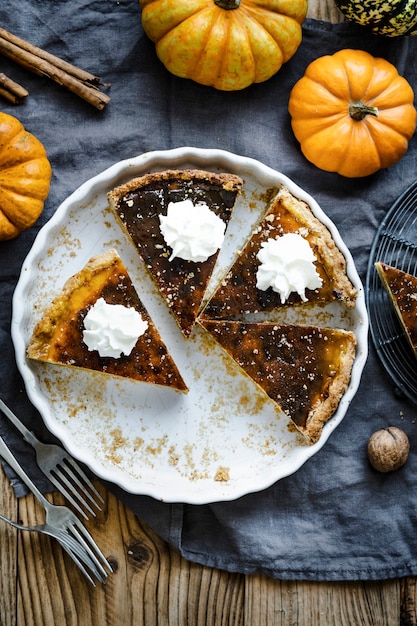 Pumpkin pie slices halloween dessert flat lay