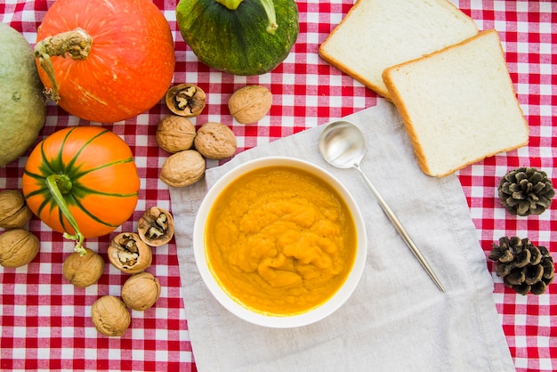 Pumpkin puree in bowl on decorated table