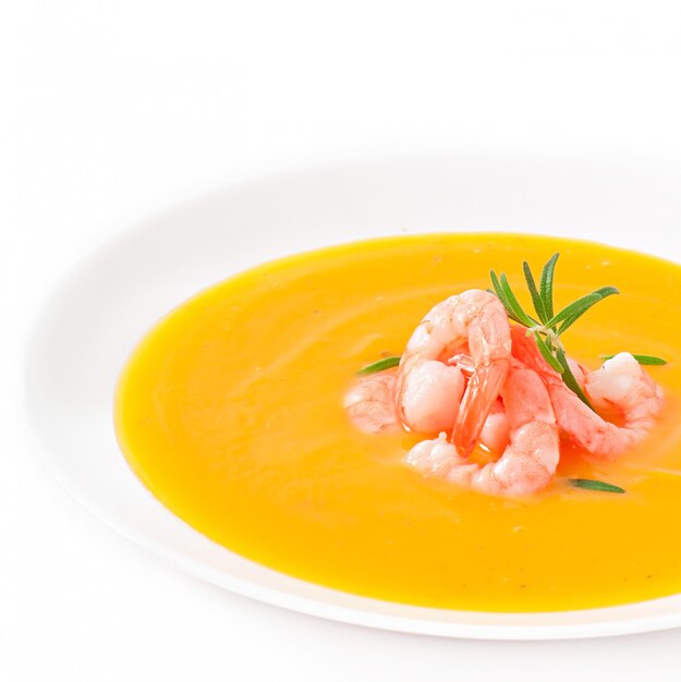 Pumpkin soup with shrimp and rosemary