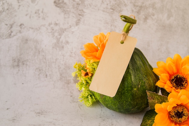 Pumpkin with flowers on table