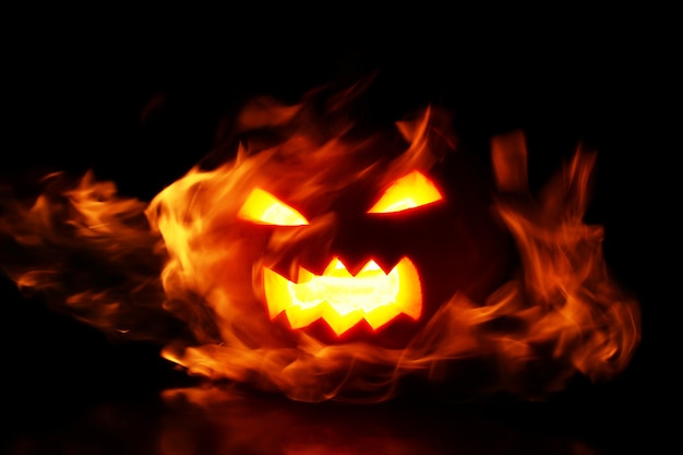 Free photo pumpkin within flames