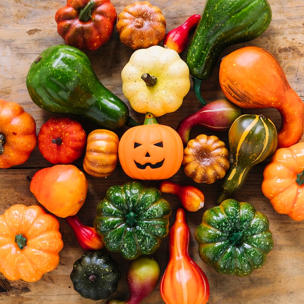 Pumpkins and Jack-O-Lantern on table 