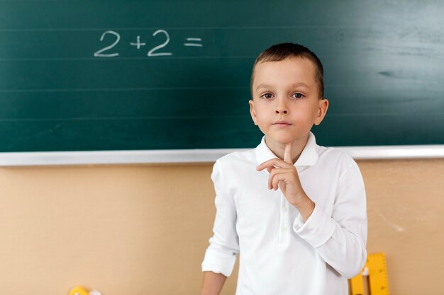 Pupil boy in math class