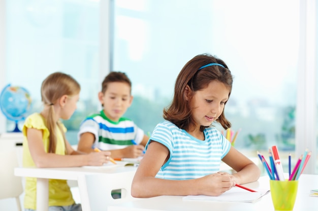 Pupil in a classroom during class