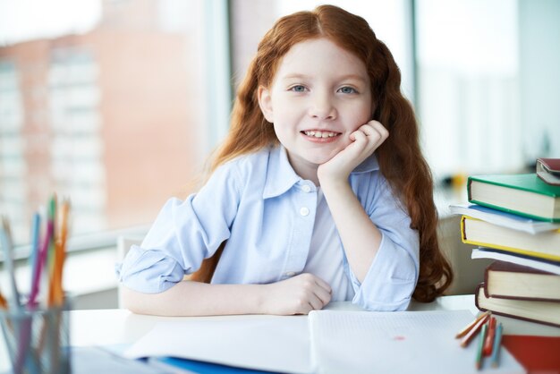 Pupil smiling in class