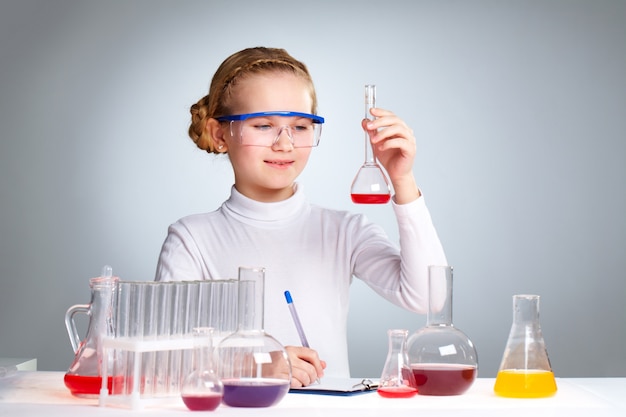Pupil studying chemistry at school