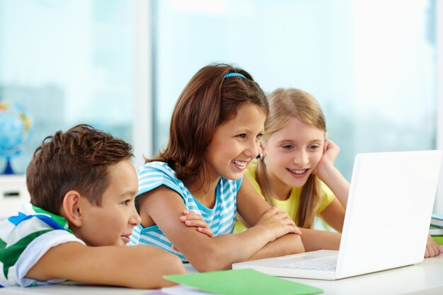 Pupils working together on a laptop