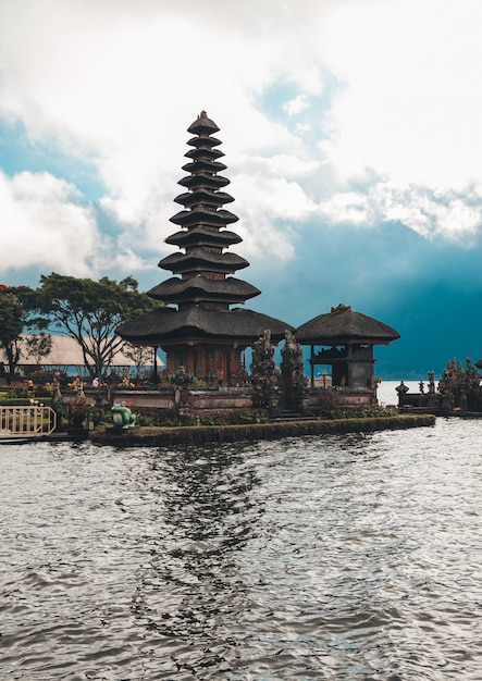 Pura Ulun Danu Bratan, Bali. Hindu temple surrounded by flowers on Bratan lake