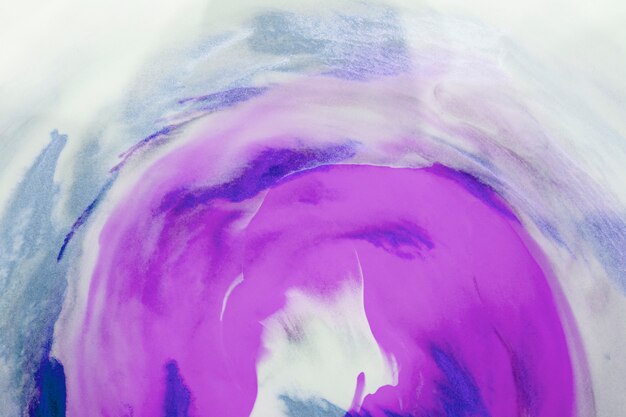 Purple and blue watercolor art over white canvas