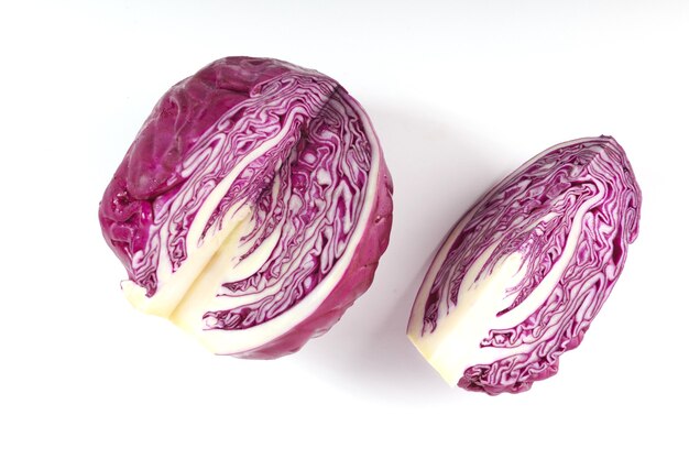 Purple cabbage isolated on white surface.
Red cabbage slice isolated on white surface.