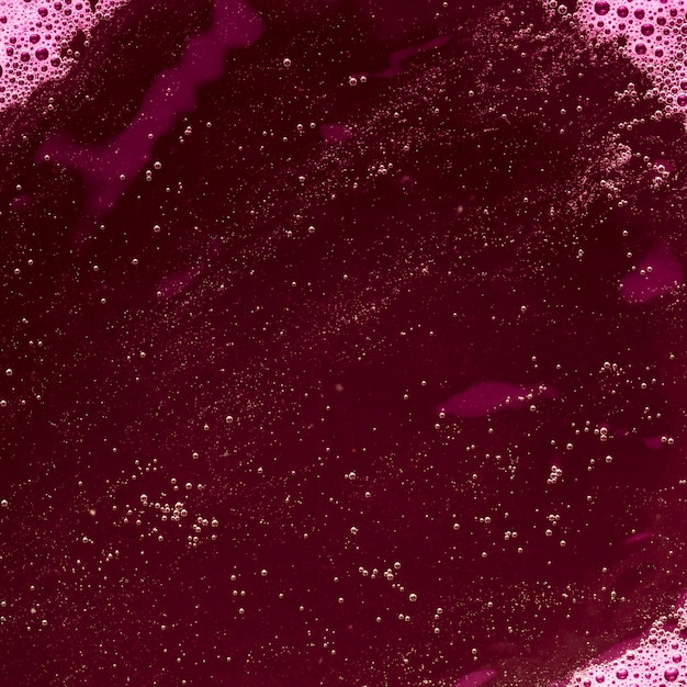 Purple colored liquid with bubbles