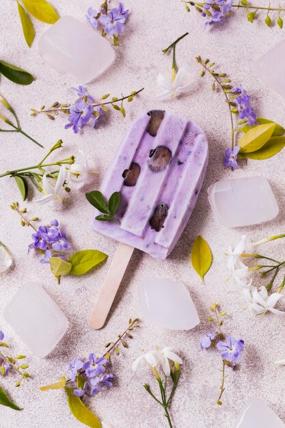 Purple flavor ice cream on sticks on table