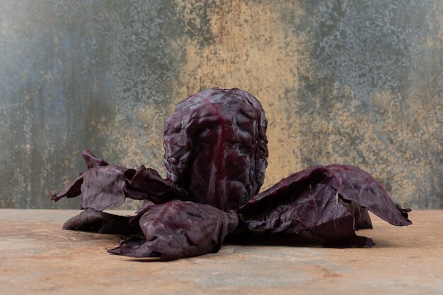 Purple fresh cabbage on marble.