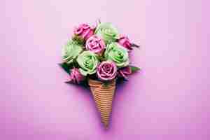 Free photo purple and green ice cream with flowers on purple background