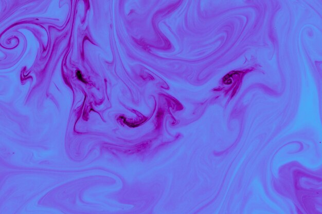 Purple liquid paint abstract background