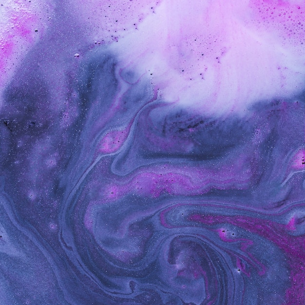 Purple liquid with light pink foam