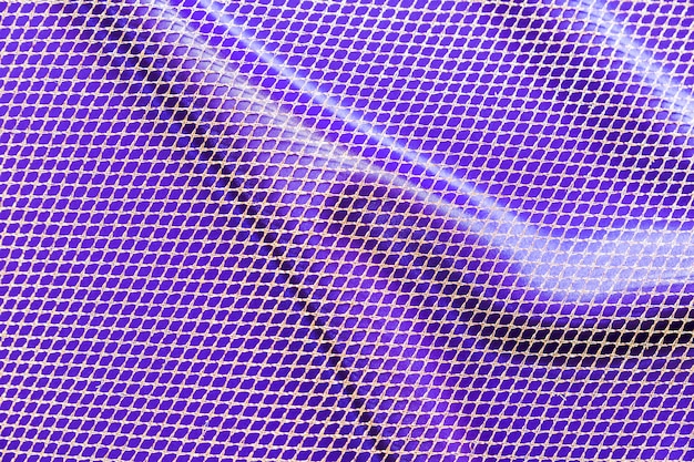 Foto gratuita priorità bassa del tessuto del reticolo di maglia viola