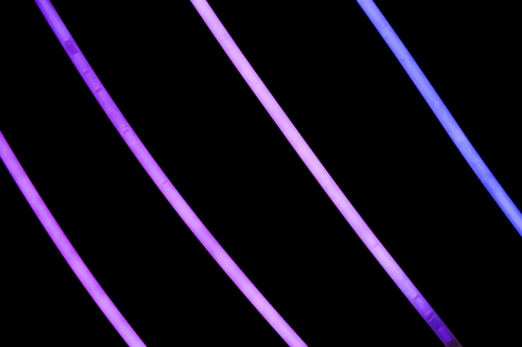 Free Photo purple neon stripes on black background