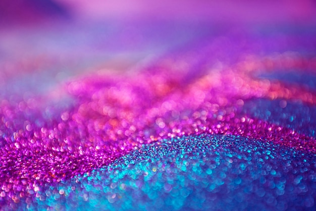 Purple and pink glitter bokeh lights background