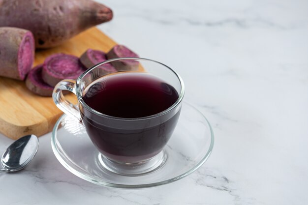 Purple potato tea on the table