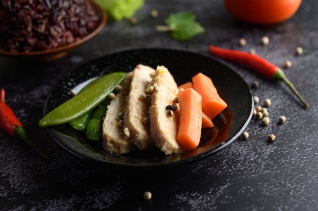 Purple rice berries cooked with grilled chicken breast. Pumpkin, carrots, and mint leaves in a dish, clean food.