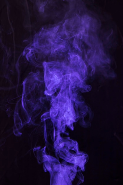 Purple smoke movement on black background