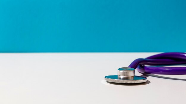 Purple stethoscope on table