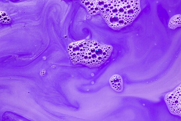 Purple stiff paint with blobs and white drips 