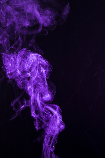 Purple swirl smoke against black background